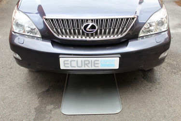 Drip tray positioned under vehicle